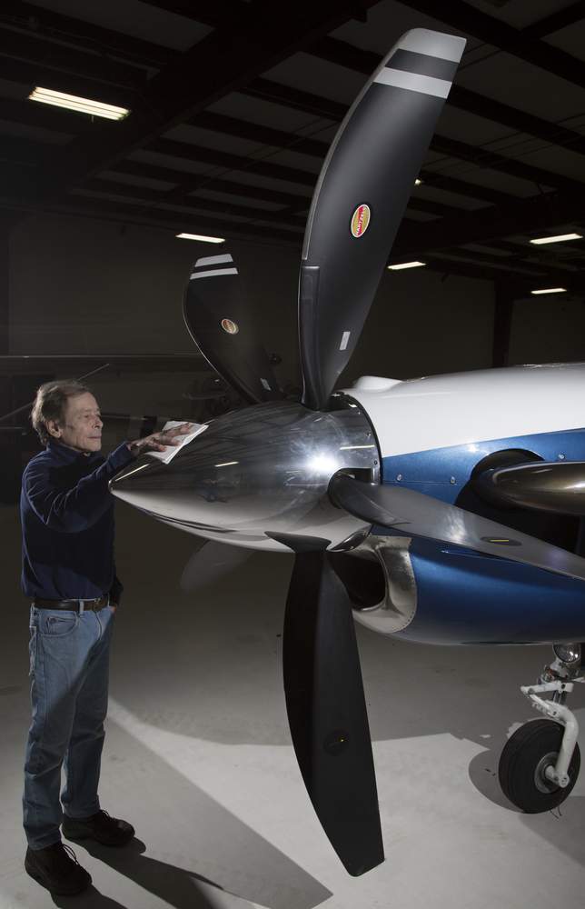 Hartzell Propeller flight department maintainer Bruce Blacke  polishes the spinner of a Hartzell aluminum hub propeller with all carbon Advanced Structural Composite, Second Generation (ASCII), swept-tip, scimitar composite blades. TY GREENLEES / STAFF