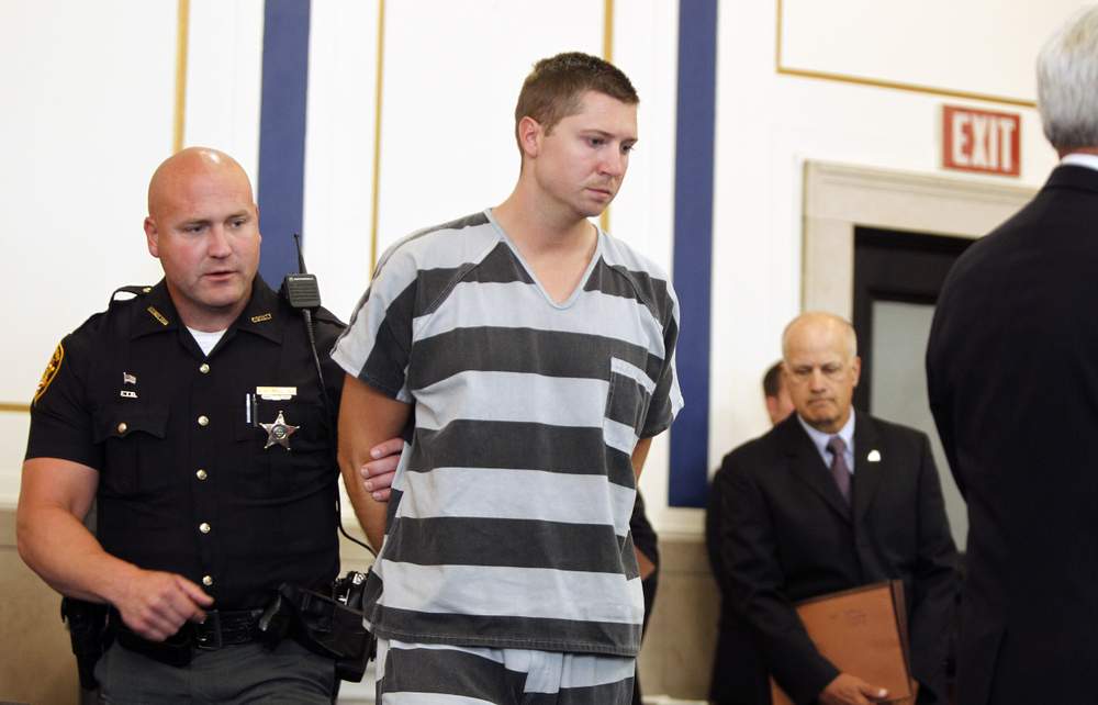 Former University of Cincinnati police officer Ray Tensing enters Hamilton County Common Pleas Court on July 30 to be arraigned on murder and involuntary manslaughter charges. MARK LYONS / GETTY IMAGES