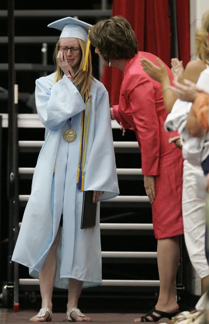 Lake High School Valedictorian Katelyn Kranz is overcome with emotion after receiving her degree during graduation ceremonies, Tuesday, June 8, 2010, at Owens Community College in Perrysburg, Ohio. The school had to move their graduation ceremonies to a new location after a tornado destroyed the school's gymnasium where graduation was to be held. Kranz's father was killed during the storm. (AP Photo/J.D. Pooley)