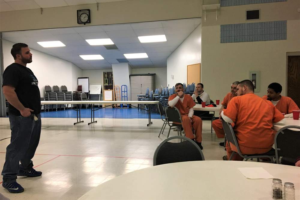 Kyle Shaw, founder of Whole Truth Ministries in Miamisburg, shares his recovery story with inmates in the STOP program on March 9, 2018. KATIE WEDELL/STAFF