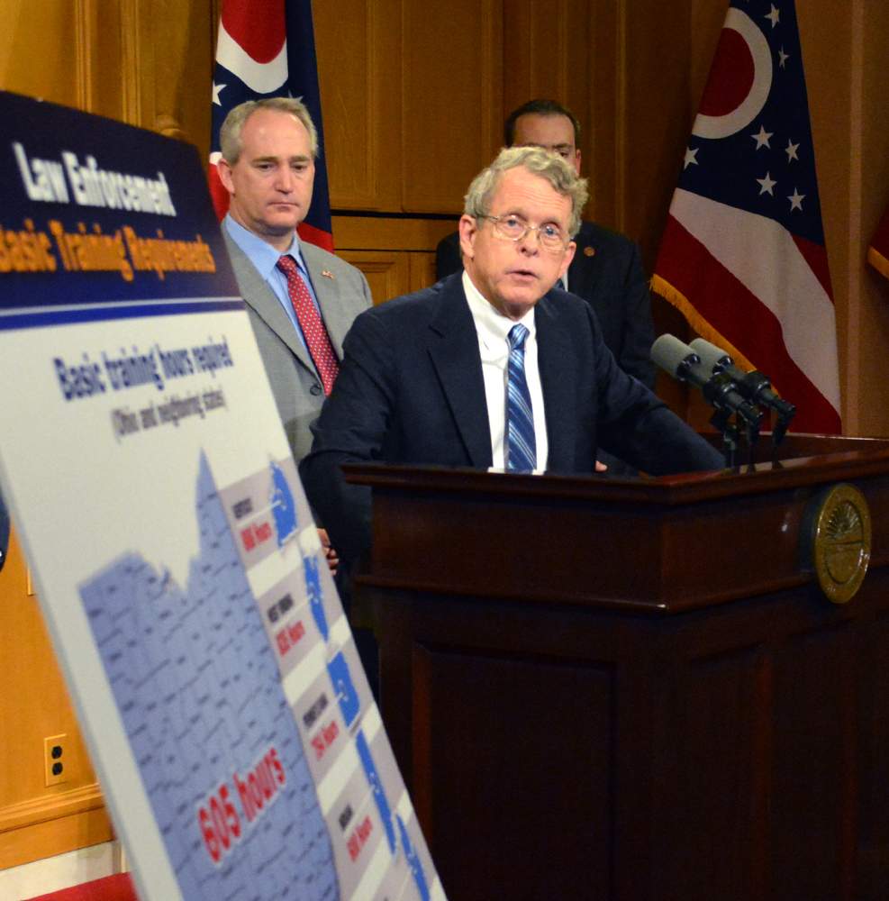 A task force convened by Ohio Attorney General Mike DeWine recommended more hours of mandated police training, which officers will receive beginning in 2016. JIM OTTE / STAFF