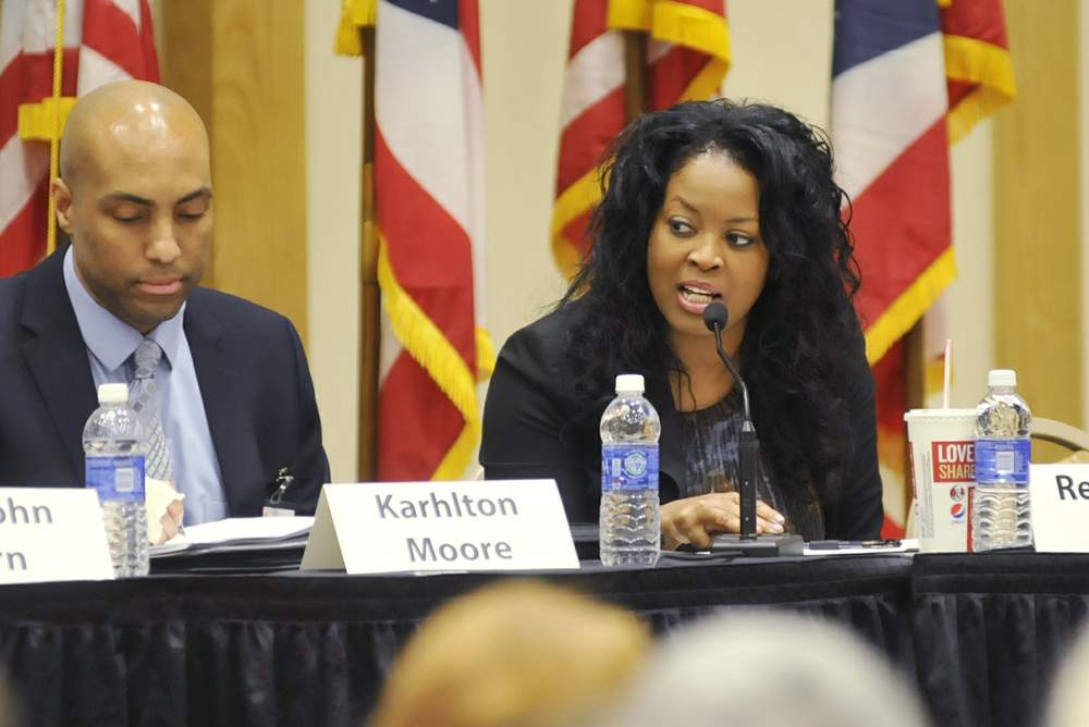 Ohio Rep. Alicia Reece, D-Cincinnati, right, speaks during the Ohio Task Force on Community-Police Relations at the Kingsgate Marriott in Cincinnati on on Monday, March 9, 2015. MICHAEL D. PITMAN / STAFF
